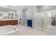 Elegant bathroom with double sinks, a shower, and a bathtub at 3959 E Gemini Pl, Chandler, AZ 85249