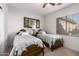 Bedroom with two twin beds and antique frames at 3959 E Gemini Pl, Chandler, AZ 85249