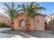 Two-story house with palm trees and a decorative window at 3959 E Gemini Pl, Chandler, AZ 85249