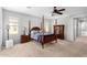 Spacious main bedroom with a four-poster bed and ensuite bathroom at 3959 E Gemini Pl, Chandler, AZ 85249