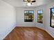 Spacious bedroom with wood flooring and large windows at 4225 N 92Nd Ln, Phoenix, AZ 85037