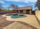 Inviting kidney-shaped pool with surrounding rock and patio at 4225 N 92Nd Ln, Phoenix, AZ 85037