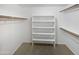 Large walk-in closet with shelving and hanging rods at 4225 N 92Nd Ln, Phoenix, AZ 85037