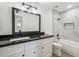 Modern bathroom with granite countertop and tiled shower at 4242 E Sacaton St, Phoenix, AZ 85044