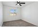 Spacious bedroom featuring carpet and a window at 4242 E Sacaton St, Phoenix, AZ 85044