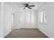 Simple bedroom with neutral walls, carpet, and ceiling fan at 4242 E Sacaton St, Phoenix, AZ 85044