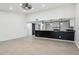 Open living room with a view into the kitchen and modern finishes at 4242 E Sacaton St, Phoenix, AZ 85044