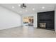 Bright living room featuring a fireplace and sliding glass doors to a patio at 4242 E Sacaton St, Phoenix, AZ 85044