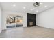 Bright living room featuring a fireplace and sliding glass doors to a patio at 4242 E Sacaton St, Phoenix, AZ 85044