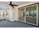 Covered patio with sliding glass doors and ceiling fan at 4242 E Sacaton St, Phoenix, AZ 85044