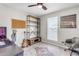 Small bedroom with a modern shelving unit, chair, and desk at 4311 E Bluefield Ave, Phoenix, AZ 85032