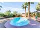 Private backyard with a refreshing pool surrounded by lush greenery and tall palm trees at 4311 E Bluefield Ave, Phoenix, AZ 85032