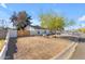 Yard featuring desert landscaping, privacy fence, and a view of the exterior of the home at 4311 E Bluefield Ave, Phoenix, AZ 85032