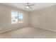 Well-lit bedroom with a large window and neutral carpeting at 432 E Harrison St, Chandler, AZ 85225