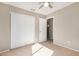 Bedroom with double door closet and carpet flooring at 432 E Harrison St, Chandler, AZ 85225