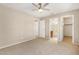 Bright bedroom featuring a ceiling fan and ample closet space at 432 E Harrison St, Chandler, AZ 85225