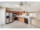 Kitchen boasts wood cabinets, stainless steel appliances, and tile floor at 432 E Harrison St, Chandler, AZ 85225