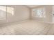 Bright living room with tile floors and large window at 432 E Harrison St, Chandler, AZ 85225