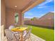 Relaxing backyard with patio furniture and grassy area at 463 W Pinnacle Ridge Dr, San Tan Valley, AZ 85140