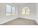 Well-lit bedroom featuring a window and neutral carpet at 463 W Pinnacle Ridge Dr, San Tan Valley, AZ 85140