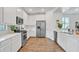 Modern kitchen with white cabinets and stainless steel appliances at 463 W Pinnacle Ridge Dr, San Tan Valley, AZ 85140