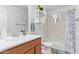 Bathroom with tub, wood vanity and window at 466 E 10Th Pl, Mesa, AZ 85203