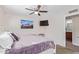 Bright bedroom with a comfortable bed and en-suite bathroom at 466 E 10Th Pl, Mesa, AZ 85203