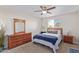 Bedroom with dresser, nightstand and ceiling fan at 466 E 10Th Pl, Mesa, AZ 85203