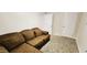 Bedroom with a brown couch, carpet flooring, and neutral walls at 466 E 10Th Pl, Mesa, AZ 85203