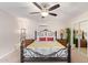 Bright bedroom featuring a comfortable bed and ceiling fan at 466 E 10Th Pl, Mesa, AZ 85203