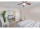 Bedroom with large bed, mirrored closet and ceiling fan at 466 E 10Th Pl, Mesa, AZ 85203