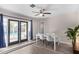 Bright dining room with white table and chairs, opens to a patio at 466 E 10Th Pl, Mesa, AZ 85203