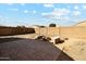 Spacious backyard with fire pit and brick patio at 4678 E Jadeite Dr, San Tan Valley, AZ 85143