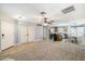 Open living room and kitchen with neutral colors and carpet at 4678 E Jadeite Dr, San Tan Valley, AZ 85143