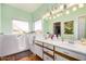 Bright bathroom featuring a window, double vanity sinks, and a walk-in bathtub at 46827 N 8Th Ave, New River, AZ 85087