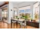 Cozy breakfast nook bathed in natural light, featuring a table for four and scenic outdoor views at 46827 N 8Th Ave, New River, AZ 85087