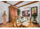 Bright dining area featuring glass-topped table, seating for six, and a large window with desert views at 46827 N 8Th Ave, New River, AZ 85087