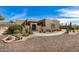 Charming single-story home featuring desert landscaping, a gated front entrance, and a private courtyard at 46827 N 8Th Ave, New River, AZ 85087