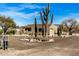 Single-story home with desert landscaping and large saguaro cactus at 46827 N 8Th Ave, New River, AZ 85087