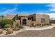 Charming single-story home featuring desert landscaping, a gated front entrance, and a private courtyard at 46827 N 8Th Ave, New River, AZ 85087