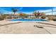 Beautiful backyard pool featuring a rock waterfall feature and desert landscaping for a serene escape at 46827 N 8Th Ave, New River, AZ 85087