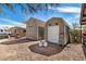 Property featuring multiple storage sheds and gravel landscaping, providing ample storage space at 46827 N 8Th Ave, New River, AZ 85087