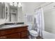 Bathroom with tub, granite vanity, and shower at 481 W Ivanhoe Pl, Chandler, AZ 85225