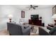 Living room featuring a wood entertainment center and seating at 481 W Ivanhoe Pl, Chandler, AZ 85225