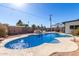 Large kidney shaped pool with surrounding patio and seating area at 481 W Ivanhoe Pl, Chandler, AZ 85225