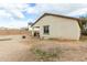 Spacious backyard with covered patio and fire pit at 4908 S 244Th Ave, Buckeye, AZ 85326