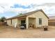 Spacious backyard with covered patio and fire pit at 4908 S 244Th Ave, Buckeye, AZ 85326