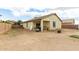 Large backyard with covered patio and fire pit at 4908 S 244Th Ave, Buckeye, AZ 85326