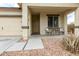 Covered front porch with small table and chairs, inviting entryway at 4908 S 244Th Ave, Buckeye, AZ 85326