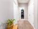 Clean hallway with neutral walls and carpet, leading to laundry room at 4908 S 244Th Ave, Buckeye, AZ 85326